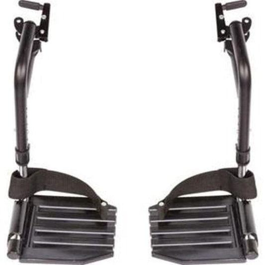A pair of Invacare wheelchair hemi footrests with black composite footplates and black heel loops.  Item number T93HCP with black tubing, black composite footrest, and heel loops in a vertical position against a white background.